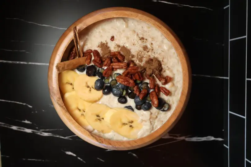 Oatmeal with banana, blueberries, pecans, and cinnamon.