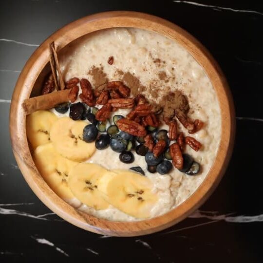 Oatmeal with banana, blueberries, and pecans.